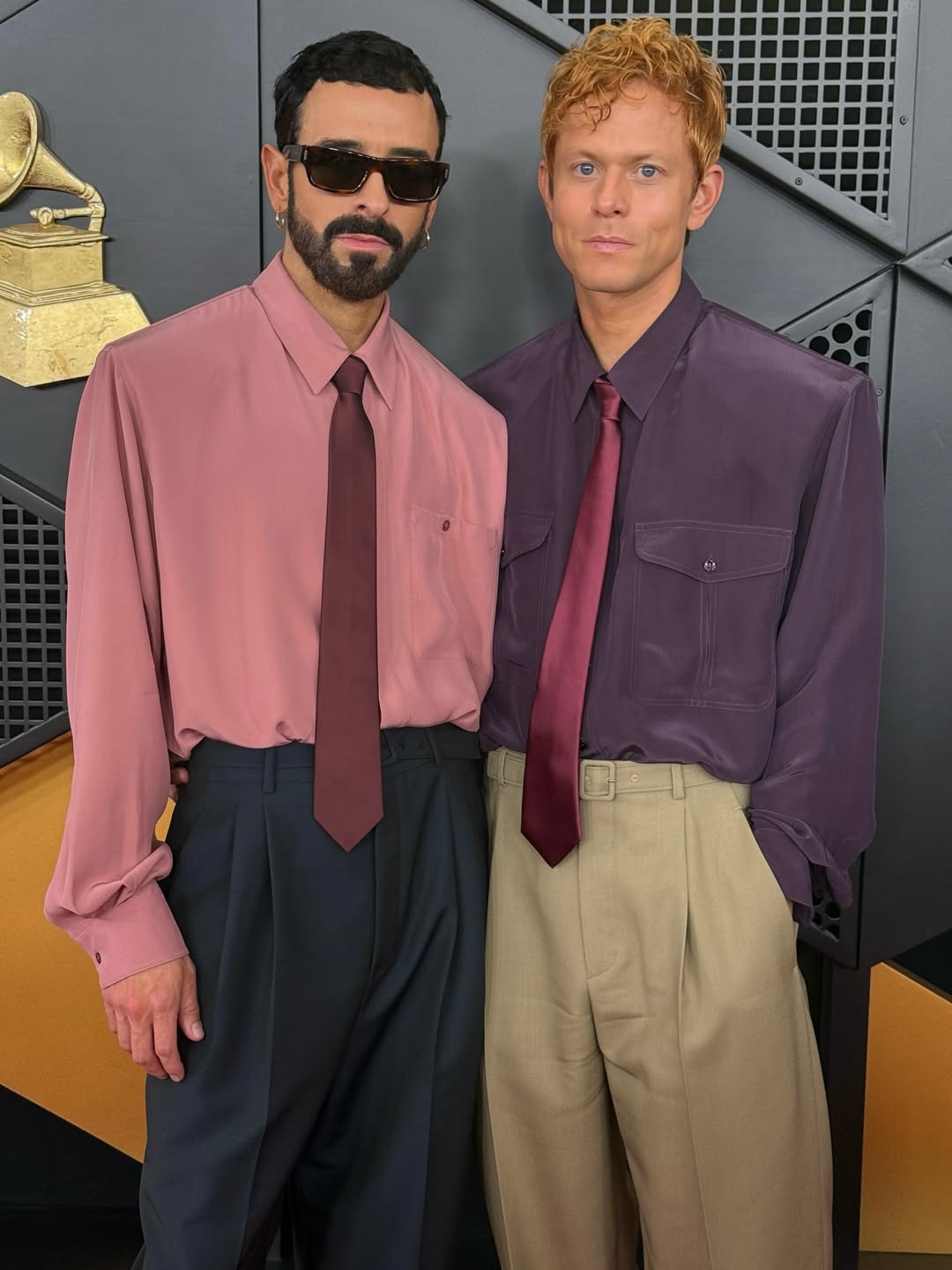 Ssion and Mike Hadreas in matching boxy outfits on the 2026 Grammys Red Carpet